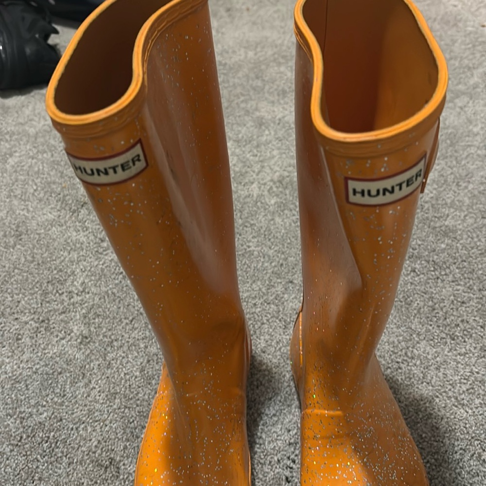 Little girl size 8 Hunter orange boot with a little sparkle